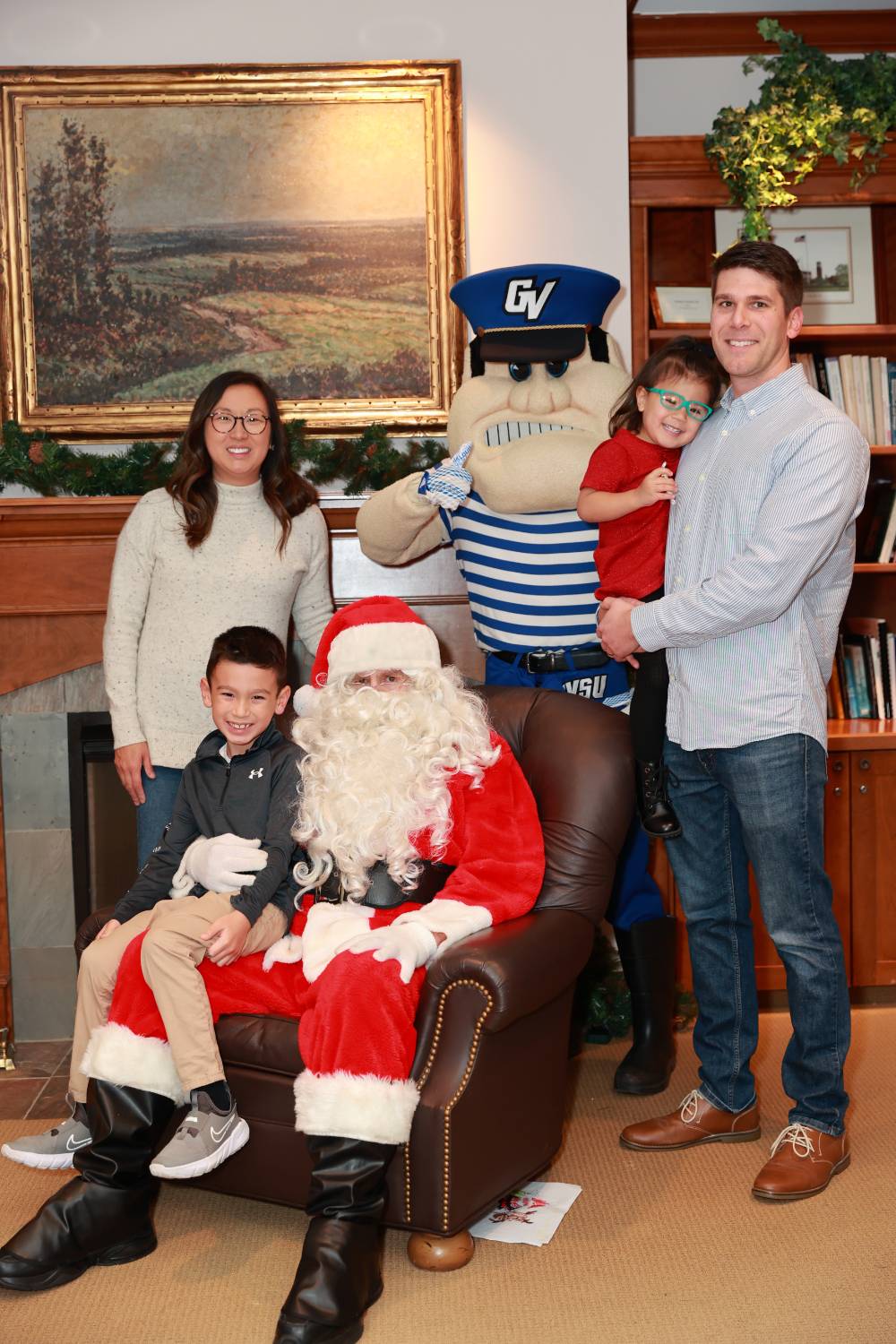 A family of five with Santa & Louie.